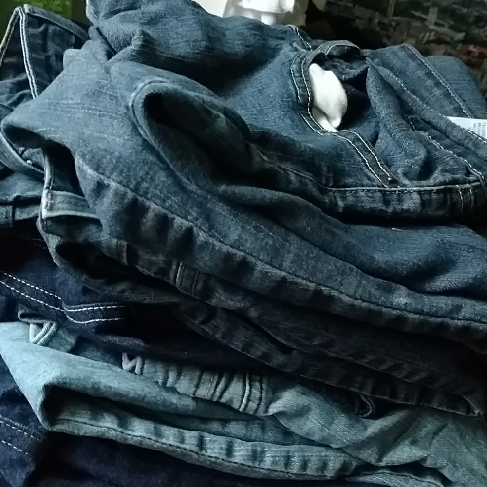 Six pairs of women’s jeans in my closet.